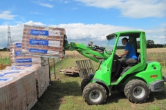 Avant moving packs of bricks